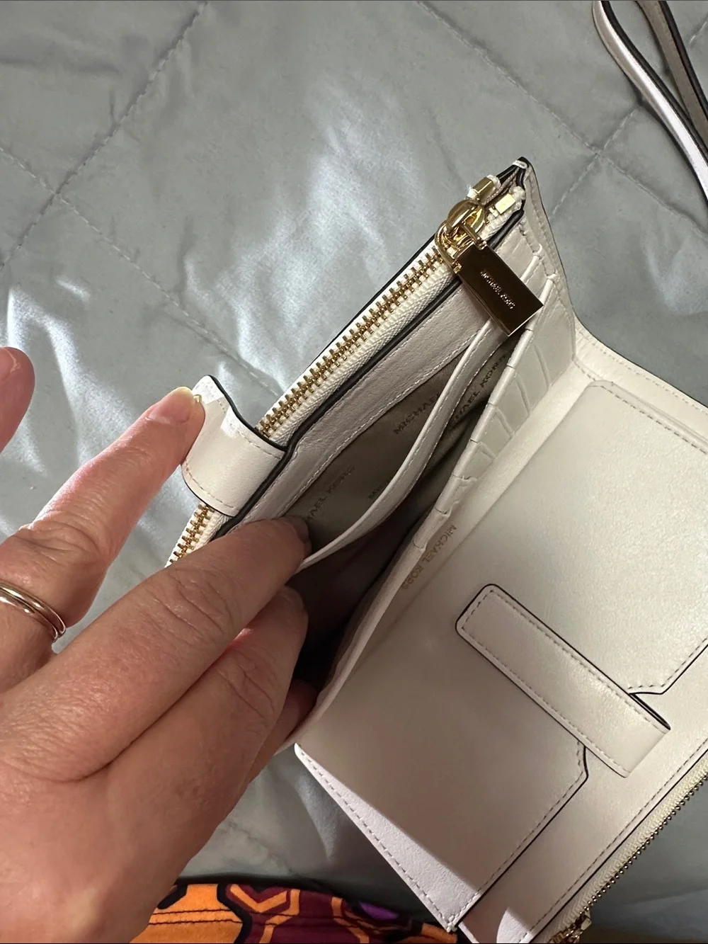 Michael Kors White Wristlet with Gold Floral Accents